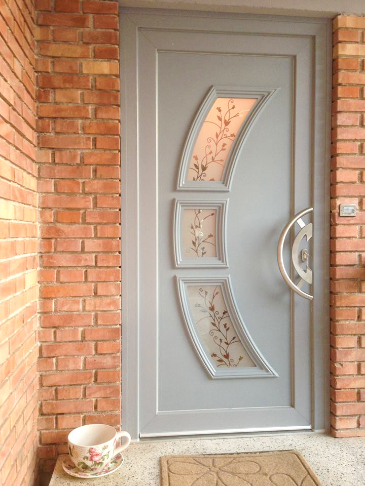 Door with panel with decorative glass